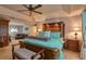 Main bedroom with large bed, plenty of space, and natural light at 13412 Fox Glove St, Winter Garden, FL 34787