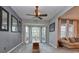 Sun-drenched living area with large windows, comfortable seating, and a wooden coffee table at 13412 Fox Glove St, Winter Garden, FL 34787