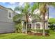 Two-story house with gray siding, lush landscaping, and a charming facade at 13412 Fox Glove St, Winter Garden, FL 34787