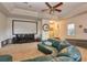 Home theater with projector and comfortable seating at 13412 Fox Glove St, Winter Garden, FL 34787