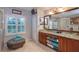 Elegant bathroom with double vanity, large mirror, and a separate shower at 13412 Fox Glove St, Winter Garden, FL 34787
