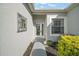 Front entry with decorative mirror and walkway to the door at 24124 Robinwood St, Leesburg, FL 34748