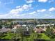 Aerial view of homes and lake in a residential community at 24124 Robinwood St, Leesburg, FL 34748