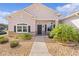 Attractive one-story home with stone accents and landscaping at 9702 Pepper Tree Pl, Wildwood, FL 34785