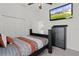 Bright bedroom with a comfortable bed and built-in closet at 9702 Pepper Tree Pl, Wildwood, FL 34785