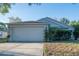 Charming one-story home with a two-car garage and well-maintained lawn at 1836 Ridge Valley St, Clermont, FL 34711
