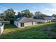 Single story house with solar panels and grassy backyard at 1836 Ridge Valley St, Clermont, FL 34711