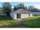 Single story house with solar panels and grassy backyard at 1836 Ridge Valley St, Clermont, FL 34711