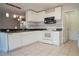Kitchen with white cabinets, stainless steel appliances, and tile floor at 1836 Ridge Valley St, Clermont, FL 34711