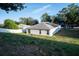 Single story house with solar panels and grassy backyard at 1836 Ridge Valley St, Clermont, FL 34711