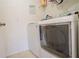 Laundry room with washer, dryer, and overhead shelving at 1836 Ridge Valley St, Clermont, FL 34711