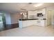 Kitchen with white cabinets, stainless steel appliances, and tile floor at 1836 Ridge Valley St, Clermont, FL 34711