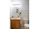 Bathroom with wood vanity, toilet and tiled floor at 1836 Ridge Valley St, Clermont, FL 34711