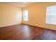 Well-lit bedroom with two windows and wood-look flooring at 1836 Ridge Valley St, Clermont, FL 34711