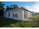 Single story house with sliding glass door and grassy yard at 1836 Ridge Valley St, Clermont, FL 34711