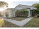 Single story house with attached garage and landscaped yard at 1836 Ridge Valley St, Clermont, FL 34711