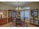Bright dining room with hardwood floors and a round table at 5000 Portsmouth St, Tavares, FL 32778