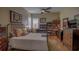 Cozy bedroom with built-in shelving and hardwood floors at 5000 Portsmouth St, Tavares, FL 32778