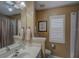 Clean bathroom with a single vanity and a large mirror at 5000 Portsmouth St, Tavares, FL 32778