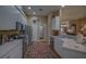 Modern kitchen with stainless steel appliances and white cabinetry at 5000 Portsmouth St, Tavares, FL 32778
