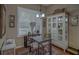 Charming dining area with a glass table and built-in hutch at 5000 Portsmouth St, Tavares, FL 32778