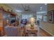 Bright living room with hardwood floors, comfortable seating, and built-in shelving at 5000 Portsmouth St, Tavares, FL 32778