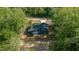 New construction home aerial view, showcasing a dark blue exterior and a driveway at 14 Guava Terrace Trce, Ocklawaha, FL 32179