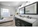Bathroom boasts double vanity, large mirror, and a soaking tub at 1405 Hilltop Dr, Mount Dora, FL 32757