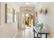 Elegant entryway with a marble console table and tasteful decor at 2185 Derringer Ave, The Villages, FL 32162