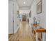 Bright entryway with hardwood floors and decorative console table at 2298 Raven Ridge Rd, Minneola, FL 34715