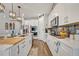 Modern kitchen with island, white cabinets, and stainless steel appliances at 2298 Raven Ridge Rd, Minneola, FL 34715