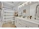 Clean bathroom with double vanity and shower/tub combo at 2298 Raven Ridge Rd, Minneola, FL 34715