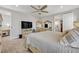 Spacious bedroom with large TV, dresser and comfortable bedding at 2298 Raven Ridge Rd, Minneola, FL 34715