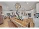 Open concept kitchen with island, stainless steel appliances, and breakfast bar at 2298 Raven Ridge Rd, Minneola, FL 34715