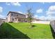 Spacious backyard with a tree and privacy fence at 2298 Raven Ridge Rd, Minneola, FL 34715