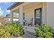 Inviting front porch with landscaping and seating area at 2298 Raven Ridge Rd, Clermont, FL 34715