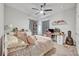 Charming bedroom with a full bed and home office space at 2298 Raven Ridge Rd, Minneola, FL 34715
