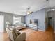 Light and airy living room with hardwood floors and neutral decor at 2714 Moncayo Ave, The Villages, FL 32162