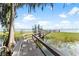 Private dock extending into a serene lake at 3509 Indian Trl, Eustis, FL 32726