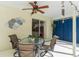 Covered patio with table and chairs, perfect for outdoor dining at 3509 Indian Trl, Eustis, FL 32726