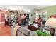 Living room with hardwood floors, comfortable seating and built-in shelving at 3721 Plantation Blvd, Leesburg, FL 34748