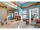 Main bathroom with double sinks, a shower, and access to a sunroom at 3721 Plantation Blvd, Leesburg, FL 34748