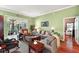 Spacious living room with hardwood floors and ample natural light at 3721 Plantation Blvd, Leesburg, FL 34748