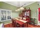 Bright dining room with wooden table and hutch at 3721 Plantation Blvd, Leesburg, FL 34748