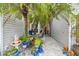Charming courtyard entry with lush landscaping and seating area at 3721 Plantation Blvd, Leesburg, FL 34748