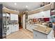 Modern kitchen with granite countertops and white cabinets at 3721 Plantation Blvd, Leesburg, FL 34748