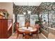 Charming breakfast nook with round table and floral wallpaper at 3721 Plantation Blvd, Leesburg, FL 34748