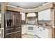 Updated kitchen with stainless steel appliances and granite countertops at 3721 Plantation Blvd, Leesburg, FL 34748