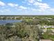 Community overview featuring a lake and lush green landscape at 3721 Plantation Blvd, Leesburg, FL 34748