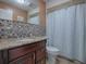 Bathroom with granite countertop and tiled shower at 4247 Allen Rd, Fruitland Park, FL 34731